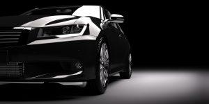Fotolia 128643483 Subscription Monthly M 300x150 - New black metallic sedan car in spotlight. Modern desing, brandless.